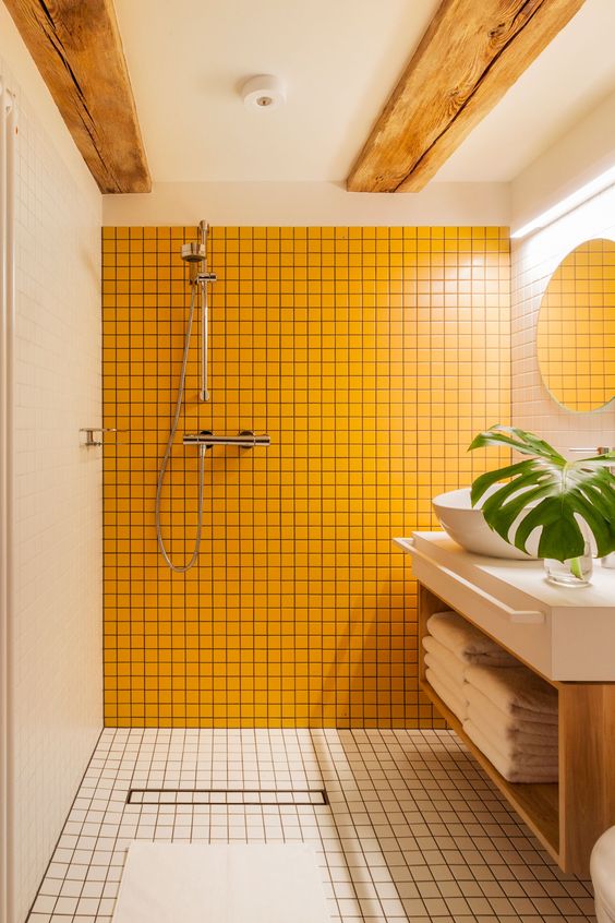 Sunny Yellow Shower Tile Creates a Bold Focal Point