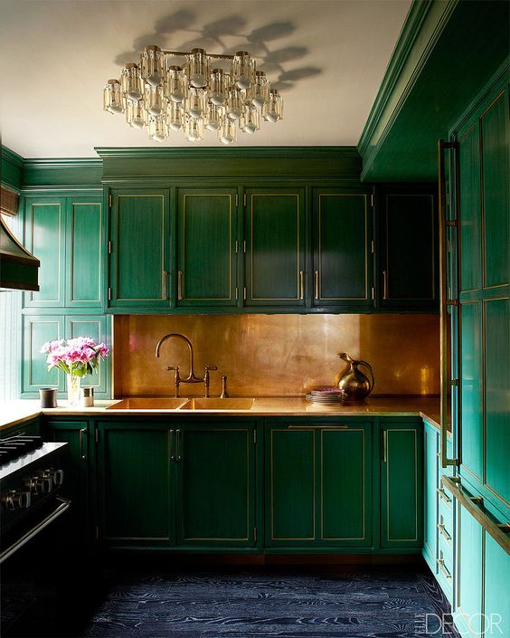Warm Brass Backsplash Adds Richness to Emerald Green Cabinets