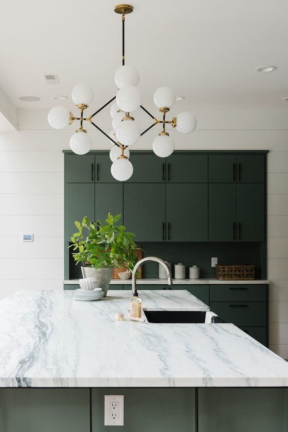Sputnik Chandelier With White Globes Over Marble Island