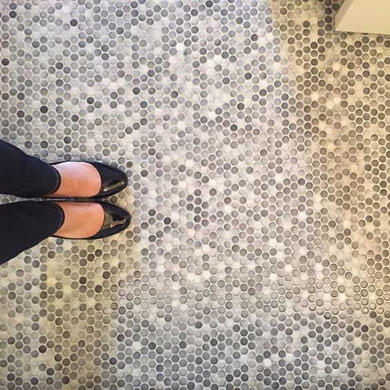 Mixed Gray Penny Tiles Create a Subtle, Speckled Floor