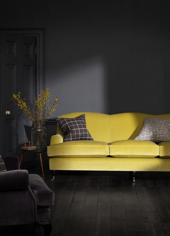 Bold Yellow Sofa Against Dark Walls