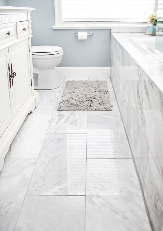 Marble Tiles With Subtle Veining Create a Classic Bathroom Floor