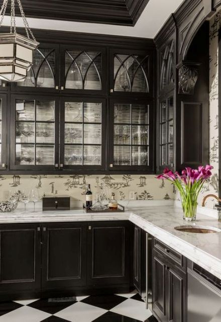Black Cabinetry With Arched Glass Panes For Display