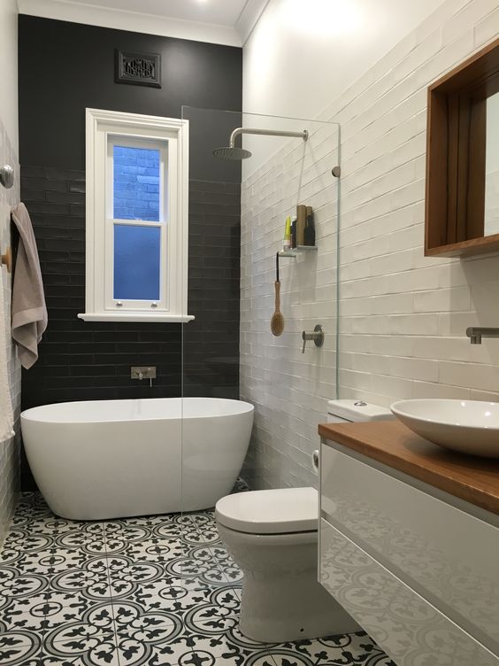 Bold Black Subway Tile Walls For A Dramatic Bathtub Area