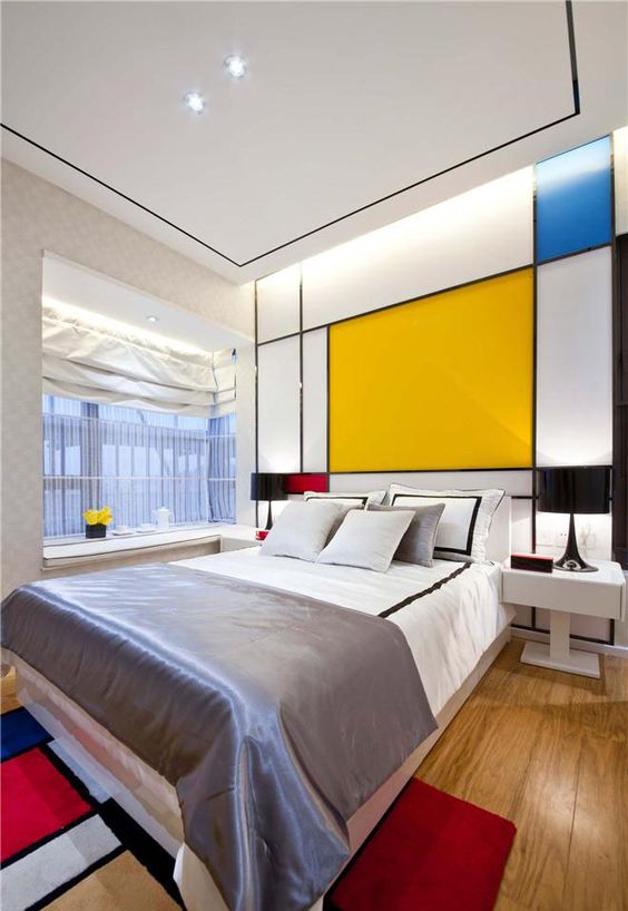 Geometric Headboard Wall Creates a Mondrian-Inspired Focal Point