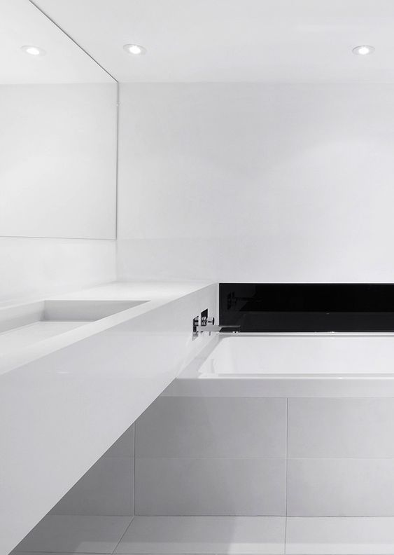 Recessed Black Shelf Adds Dramatic Contrast Above Bathtub