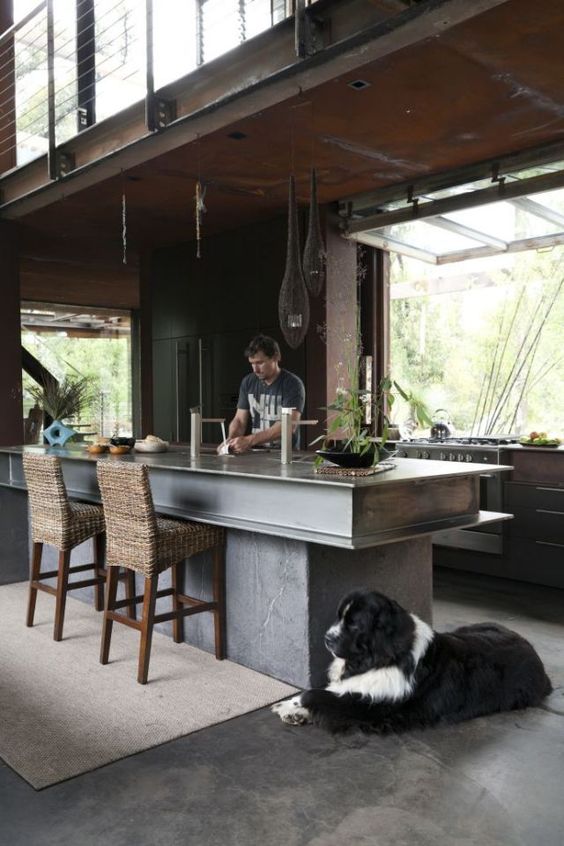 Anchor Your Kitchen with a Concrete Island and Woven Bar Stools