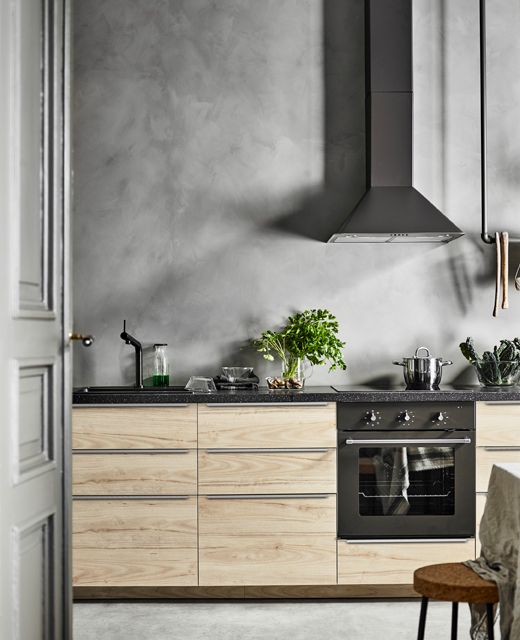 Textured Grey Wall Creates a Dramatic Kitchen Backdrop