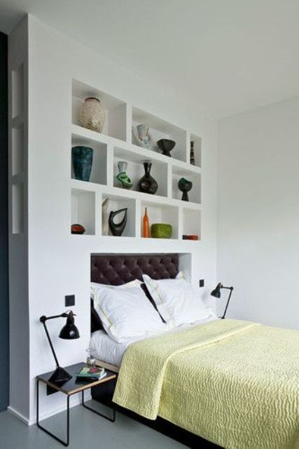 White Niches Display Sculptural Vases and Colorful Objects