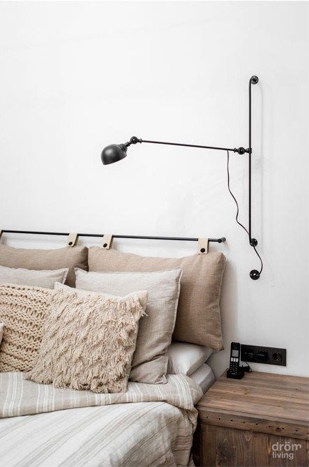 Adjustable Wall Lamp Creates a Cozy Reading Nook