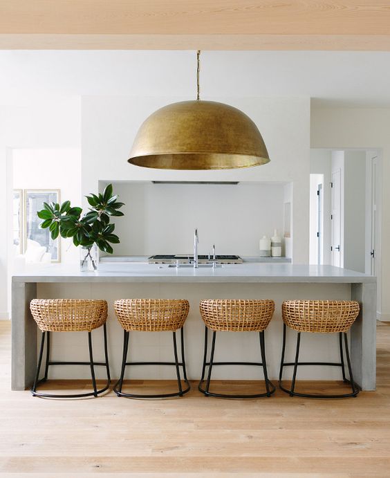 Woven Bar Stools Add Organic Texture to Concrete Island
