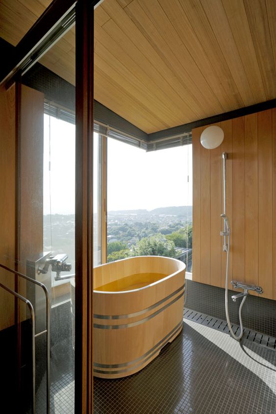 Warm Your Bath Space with an Oval Wooden Bathtub