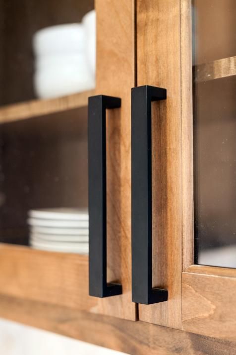 Matte Black Bar Pulls Create a Bold Contrast on Wood Cabinets