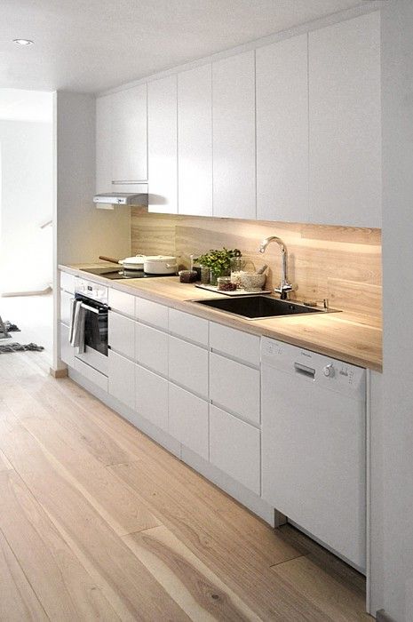Light Wood Backsplash Brightens White Cabinets