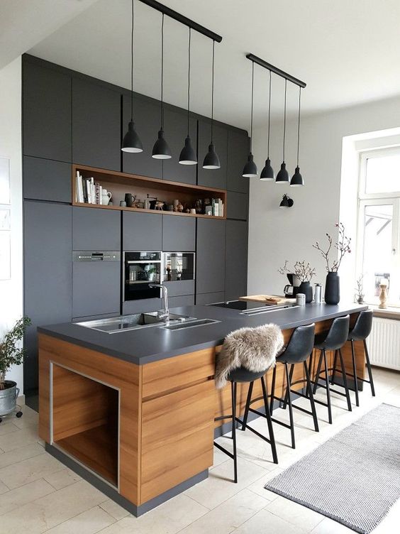 Black Pendant Lights Create a Shadow Play Over the Island