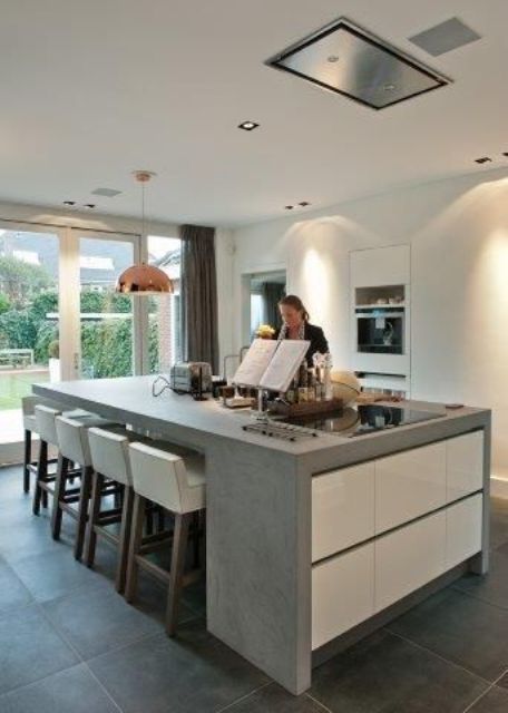 Concrete Island With Integrated Seating and Storage