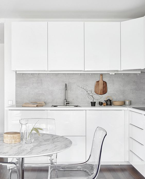 Hanging Cutting Board Adds Rustic Charm to Concrete Backsplash