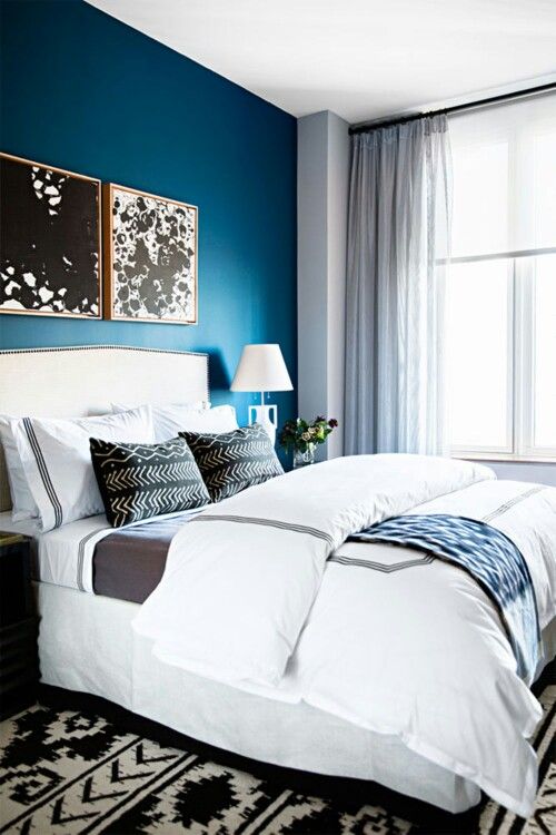Abstract Art Adds Bold Contrast Above the Bed