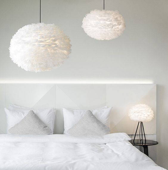 Feathered Pendants Add Dreamy Texture Above Bed