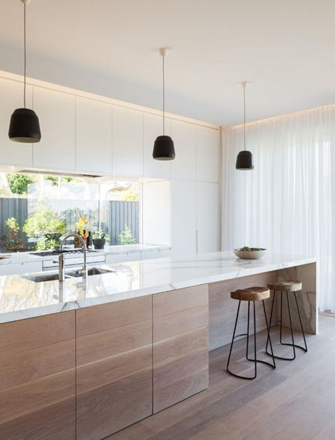 Wood Cabinets Paired with Marble Waterfall Island