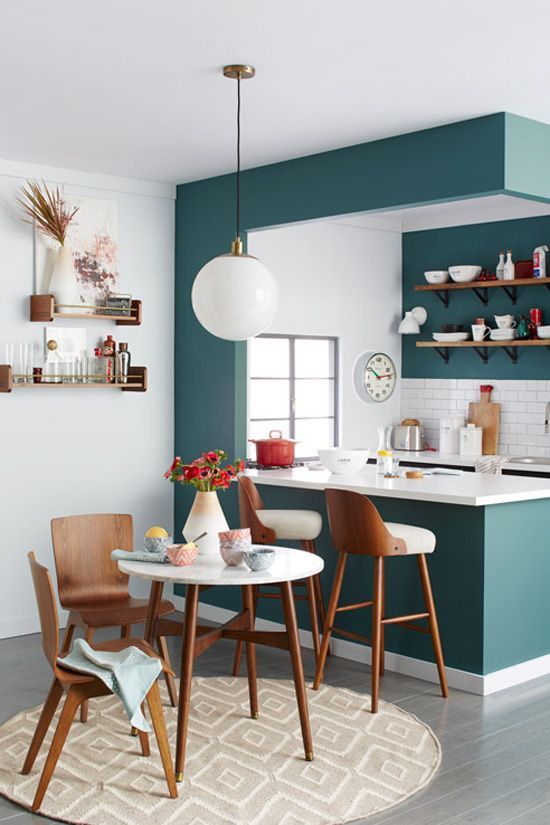 Mid-Century Chairs Add Organic Warmth to a Small Dining Area
