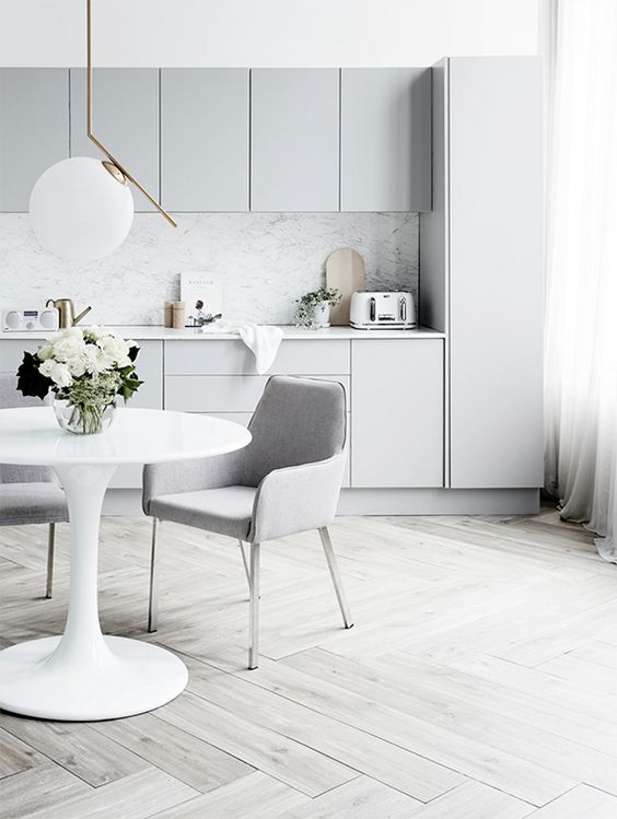 Pair Pale Grey Cabinets with Marble for an Airy Feel