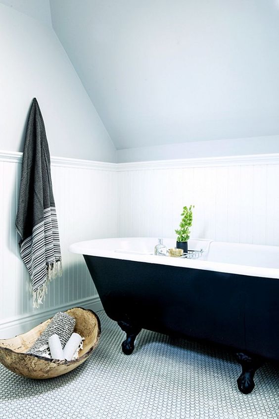 Wooden Bowl Holds Rolled Towels and Toiletries