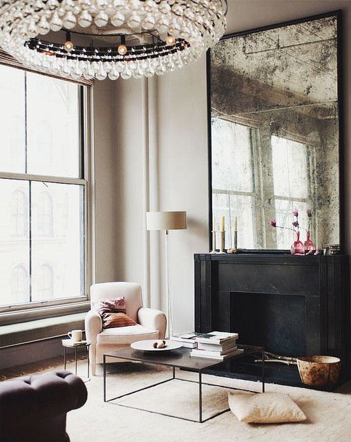 Oversized Distressed Mirror Reflects Light and Adds Depth