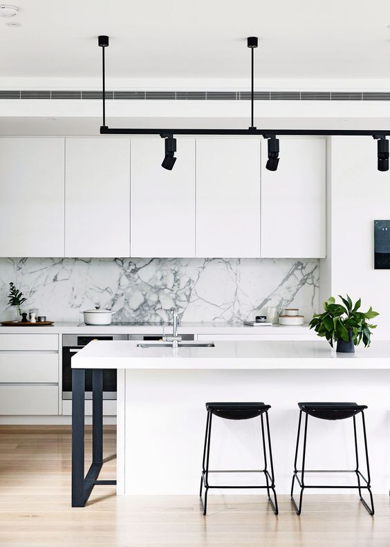 Black Bar Stools Add Sharp Contrast to White Island