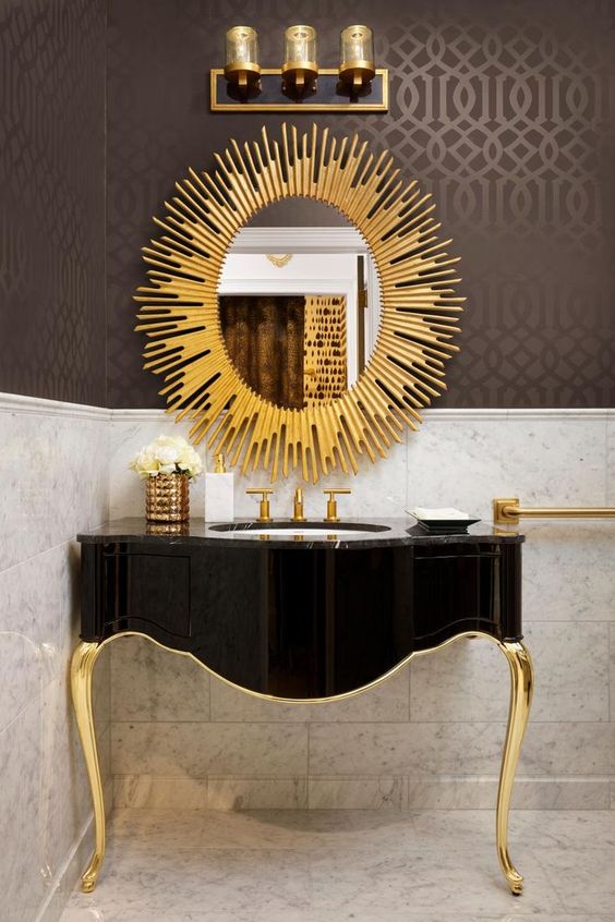 Sunburst Mirror Reflects Glamour Above Black Vanity