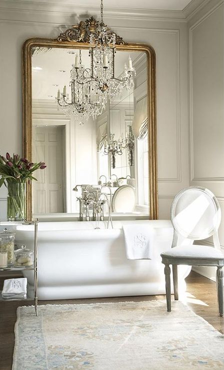Frame Your Bathtub with an Ornate Gold Mirror