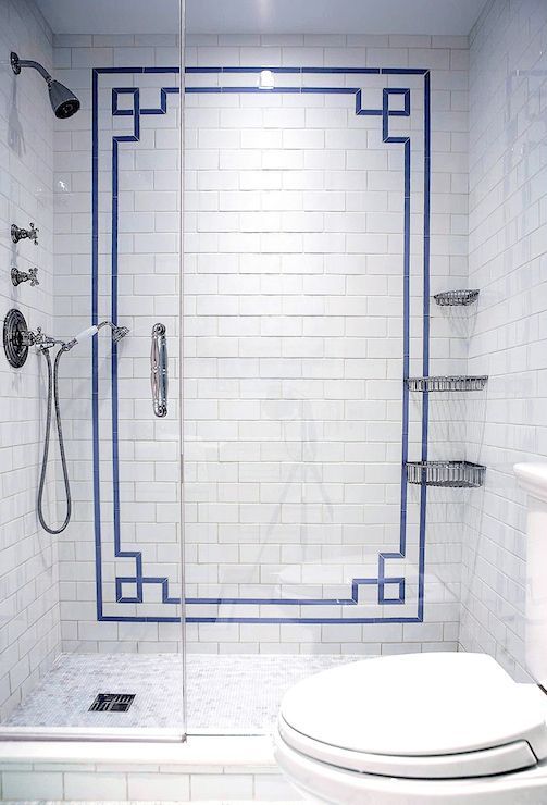 Greek Key Tile Border Frames a White Subway Tile Shower