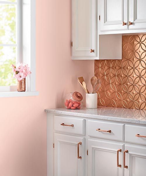 Geometric Copper Backsplash Adds Pattern Behind White Cabinets