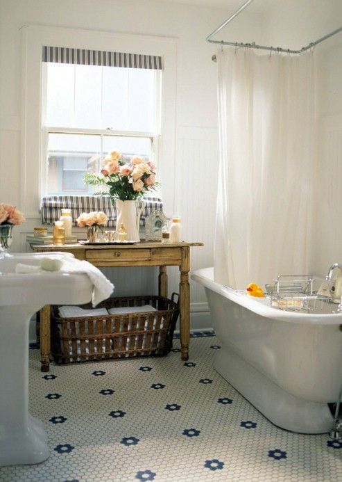 Woven Basket Stores Towels Under a Distressed Table