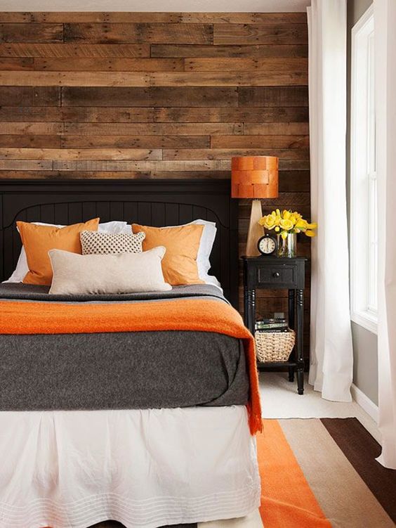 Horizontal Wood Planks Add Warmth Behind the Bed
