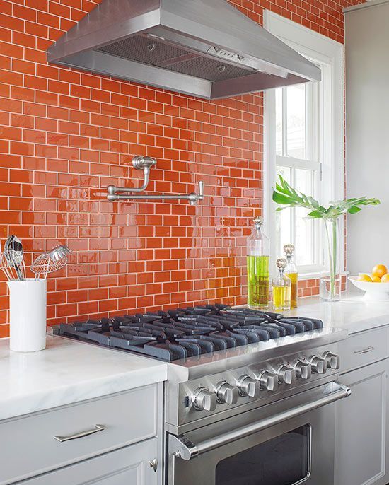 Glossy Orange Subway Tile Backsplash Creates a Vibrant Kitchen Focal Point