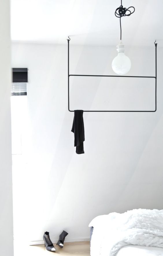 Minimalist Black Rail For Hanging A Single Outfit