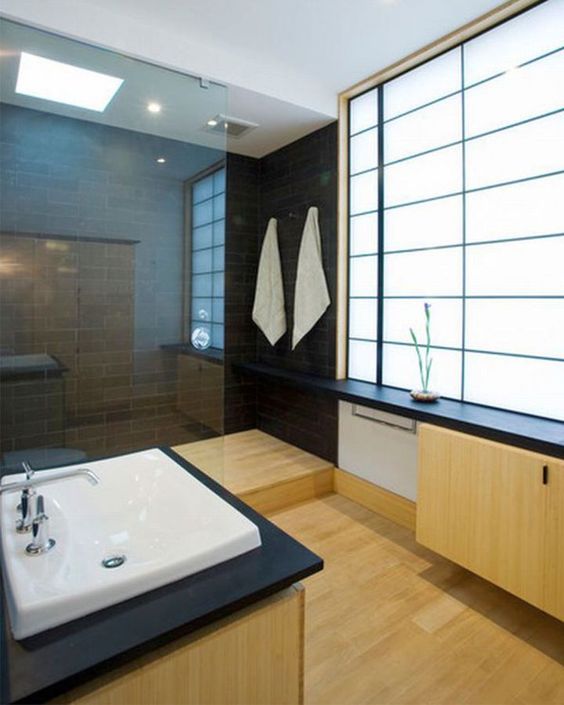 Dark Wood Paneling Creates a Dramatic Contrast for the Sink