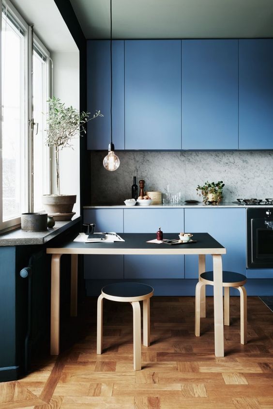 Light Wood Stools Add Natural Contrast to Blue Kitchen