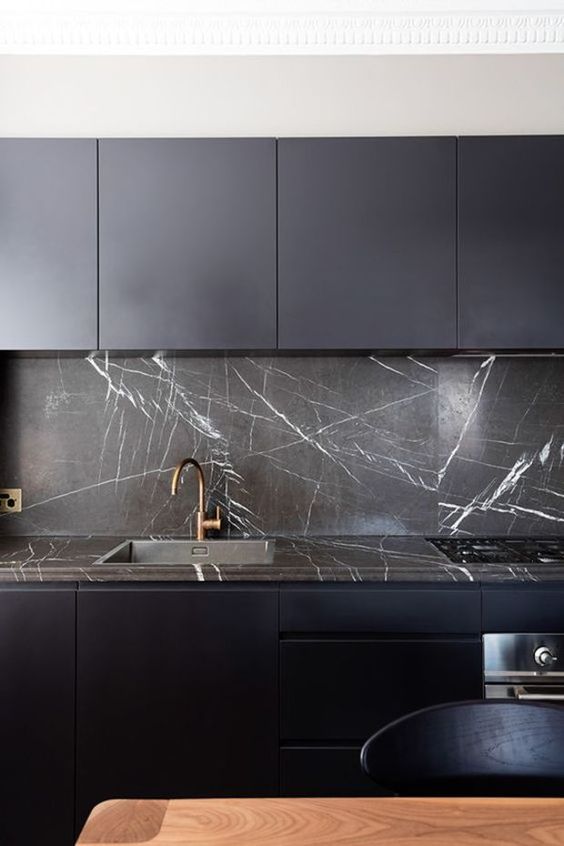 Dark Marble Backsplash With Matching Countertop