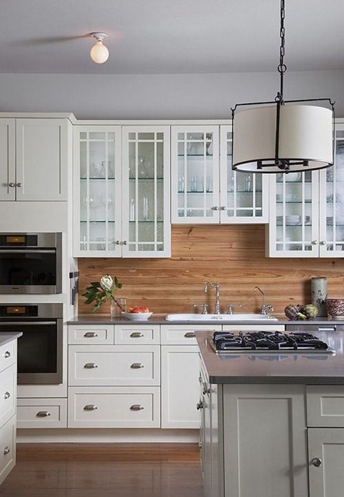 Horizontal Wood Plank Backsplash Contrasts with White Cabinets