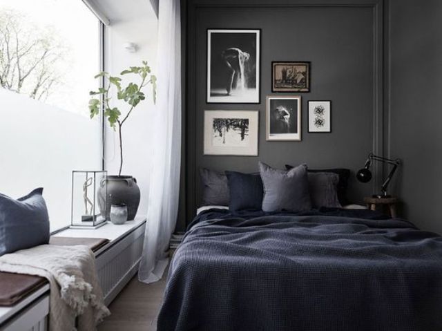 Gallery Wall of Black and White Art Adds Moody Depth