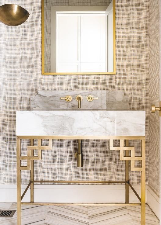Geometric Brass Stand Supports Marble Sink With Art Deco Flair