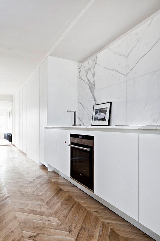 Framed Art Adds a Personal Touch to Marble Backsplash