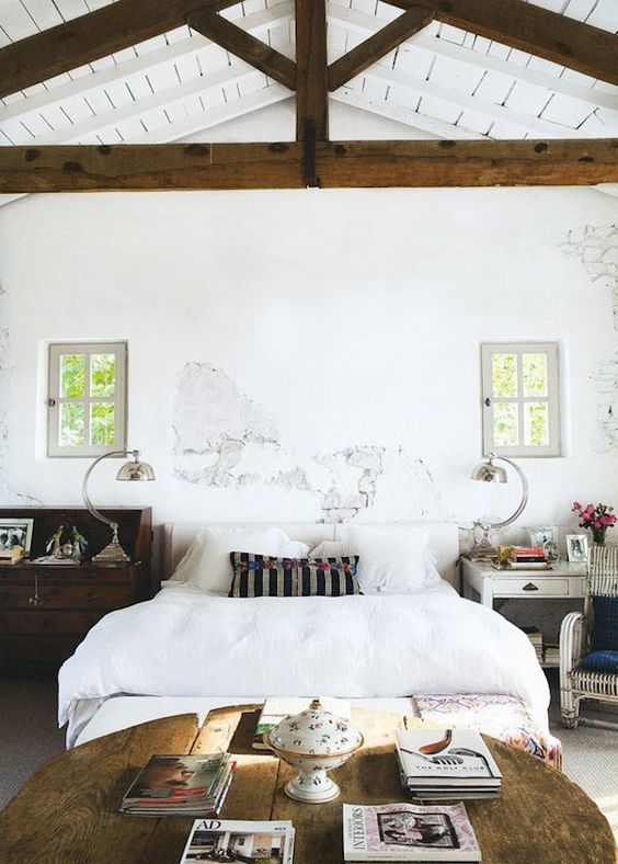 Rustic Wooden Trunks as Mismatched Bedside Tables