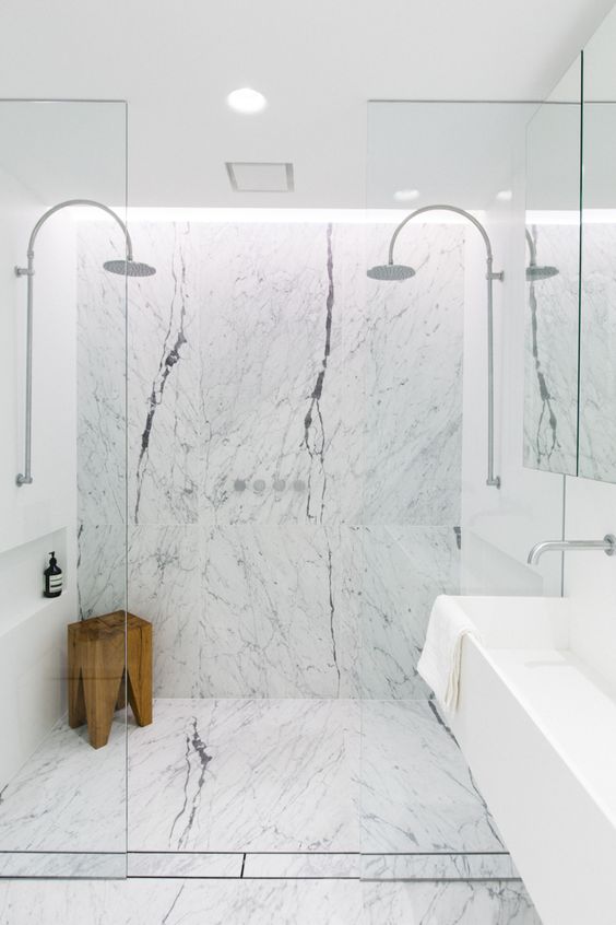 Wooden Stool Adds Natural Texture to Marble Shower