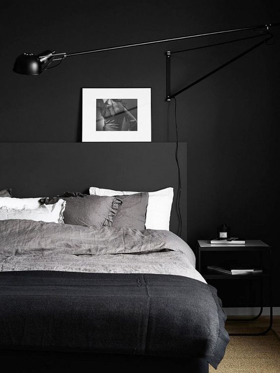 Adjustable Wall Lamp Offers Task Lighting Above the Bed