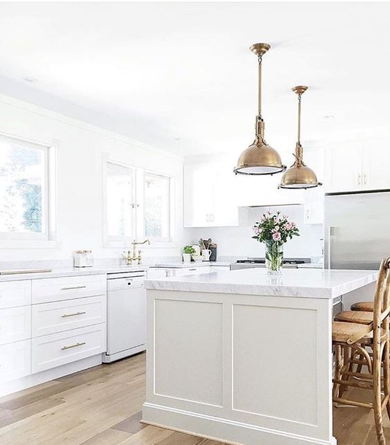 Brass Bell Pendants Add Industrial Charm Over Island