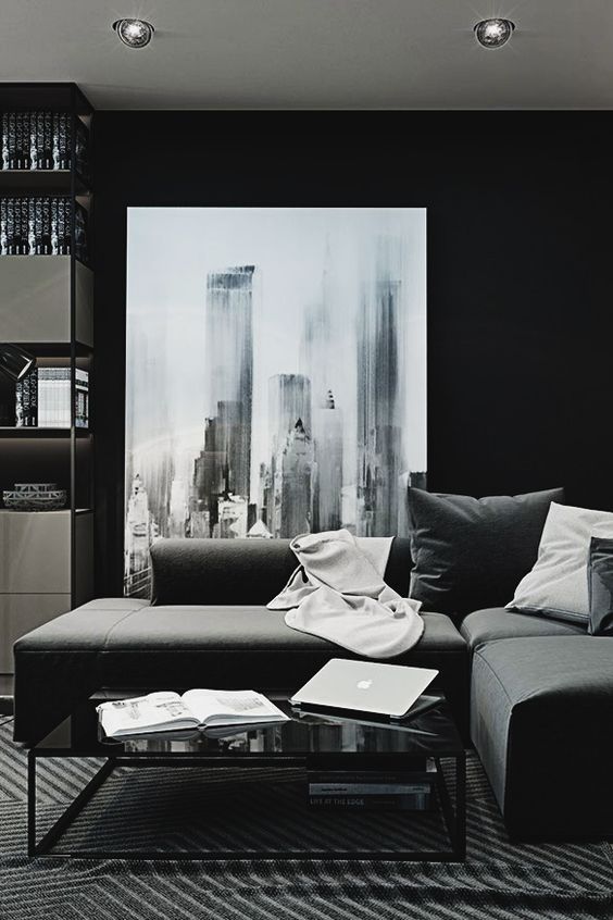 Large Abstract Artwork Anchors a Moody Monochrome Space