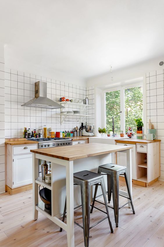 Industrial Stools Add a Metallic Touch to a Wooden Island